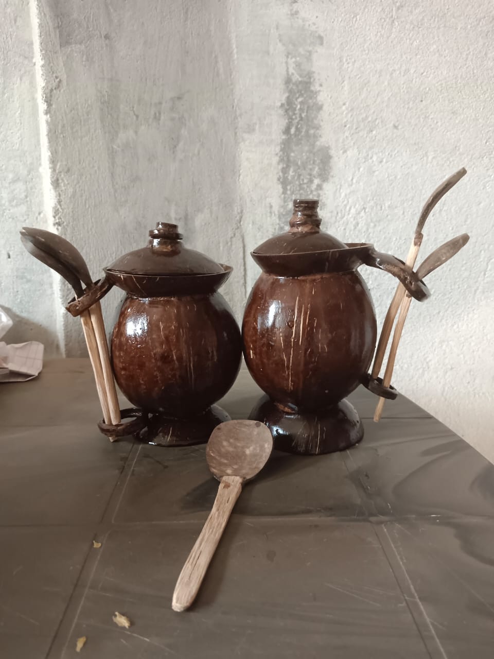 Handcrafted Coconut Shell Oil Dispenser with Wooden Spoon – Eco-Friendly Kitchen Jar | Natural & Sustainable Tableware